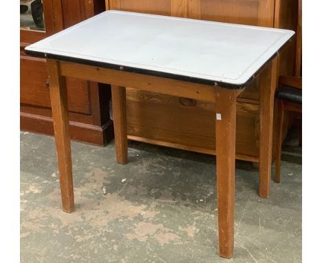 A mid century white enamel topped kitchen table, on pine base, by Remploy Ltd., 64x92x77cm 