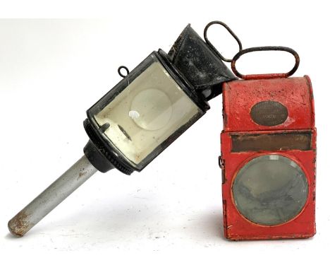 A 19th century carriage lamp with convex glass; together with a red painted carriage lamp (one beveled glass plate missing), 