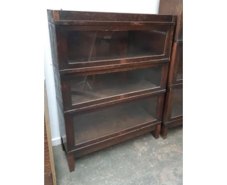 An oak Globe-Wernicke three section bookcase, each section with plaque, 88x29x116cm 