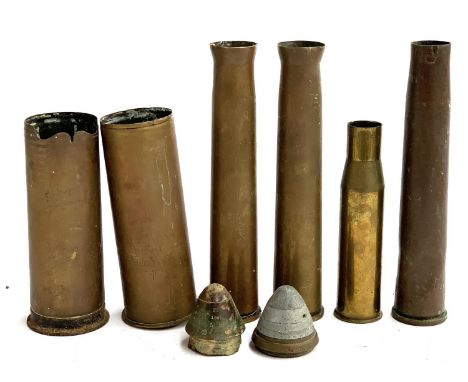 A quantity of shell cases, some engraved XXI Corps Haifa Sept. 1918; Battle of Arras April 1917; together with two heads; the