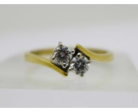 An 18ct gold and two stone diamond ring, 2.5g, M