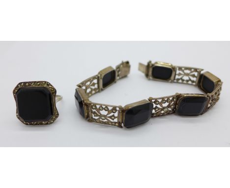 A silver, marcasite and onyx bracelet and ring