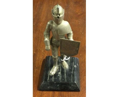 A table lighter in the form of a knight in armour. Marked to base, 'Germany'. Est. £20 - £30.