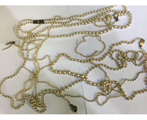 A box containing pearl necklaces etc. Est. £20 - £30.