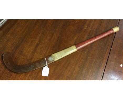 A miniature hockey stick with silver plaque engraved, 'HMS Gould 1945'. Est. £20 - £30.