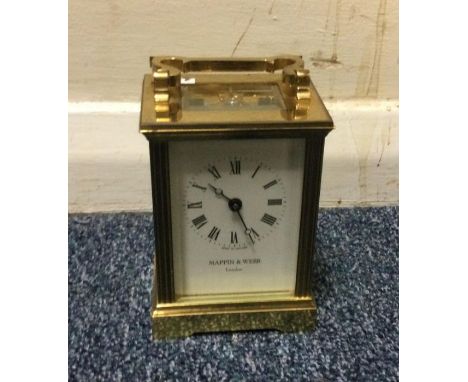 A brass carriage clock by 'Mappin &amp; Webb'. Est. £20 - £30.