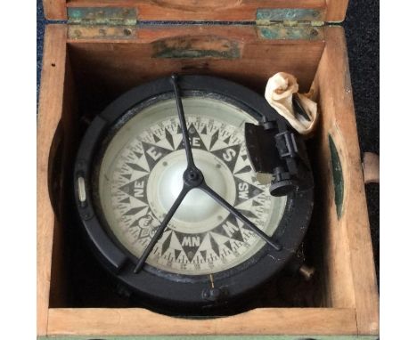 A cased ship's compass of typical form. Est. £10 - 320.