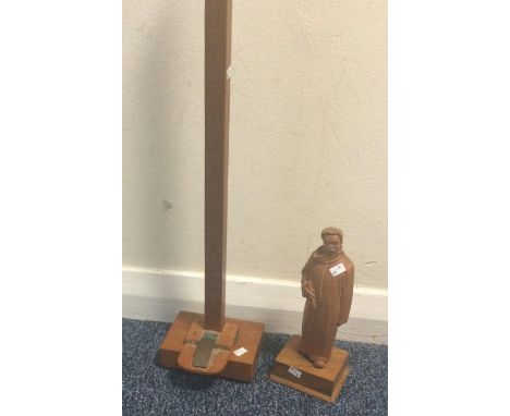 A Military skirt hemline measuring stick together with a wooden figure on stand. Est. £10 - £20.
