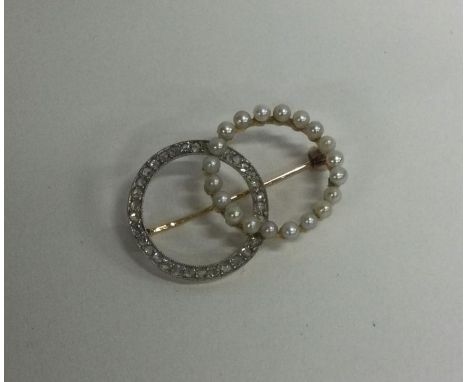 An attractive Victorian pearl and diamond brooch in two colour gold. Approx. 7 grams. Est. £300 - £400.