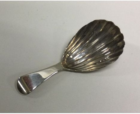 An 18th Century silver caddy spoon with fluted bowl. London 1794. Approx. 8 grams. Est. £50 - £80.