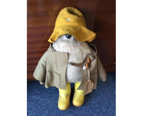 An original Paddington Bear wearing Dunlop wellies. Est. £20 - £30.