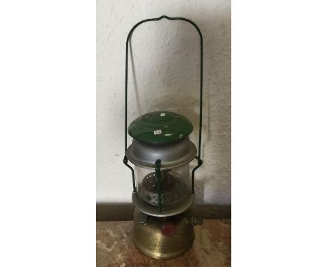 A brass mounted Tilly lamp. Est. £15 - 320.