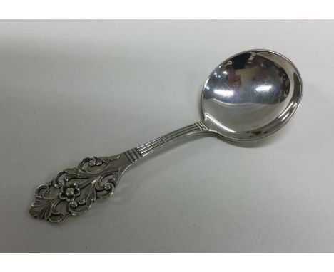 A decorative Norwegian silver caddy spoon. Approx. 14 grams. Est. £30 - £50.