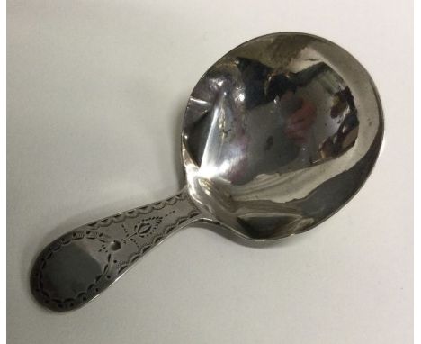 A large Georgian silver caddy spoon with bright cut decoration. London 1794. By James Phipps. Approx. 11 grams. Est. £70 - £8