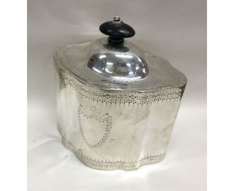 A large engraved George III silver tea caddy with hinged lid. London 1777. By Henry Chawner. Approx. 396 grams. Est. £1200 - 