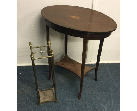 A Victorian occasional table together with a stick stand. Est. £20 - £30.