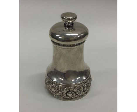 TIFFANY &amp; CO: A silver pepper grinder with chased decoration. Approx. 156 grams. Est. £250 - £300.