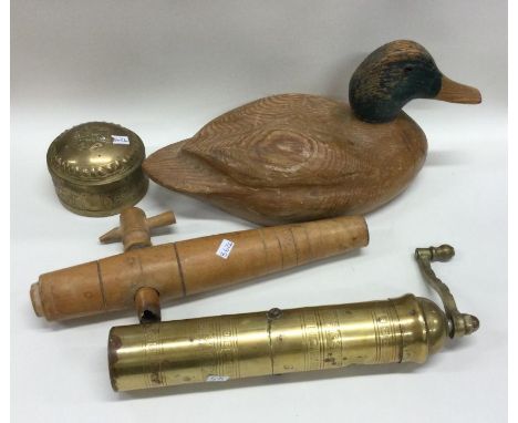 A wooden decoy duck together with a grinder etc. Est. £30 - £40.