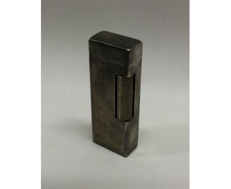 DUNHILL: A silver plated lighter. Signed to base. Est. £50 - £80.