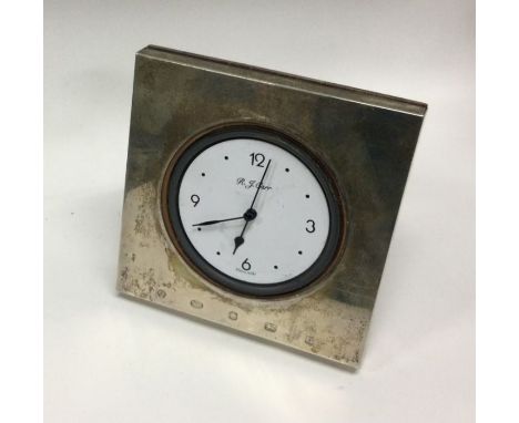 A silver desk clock. Retailed by Carrs of London. London. By Richard Comyns. Approx. 158 grams. Est. £60 - £80.