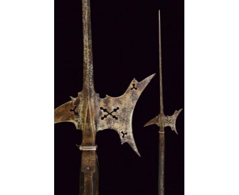dating: circa 1600 provenance: Germany, Long cusp of square section, dark axe with concave cuts, rear fluke curved downwards,
