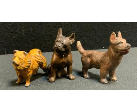 A small patinated cast metal model as a seated French Bulldog, 58mm high;  another Terrier puppy , 55mm high, 71mm long;  a h