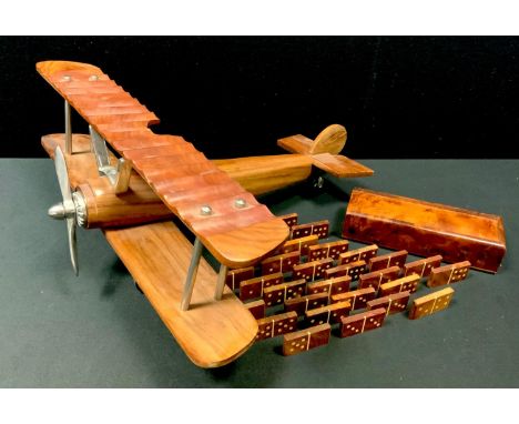 A tropical mahogany model of a Sopwith Camel, chrome fittings 45cm wingspan; a walnut domino set and box (2) 