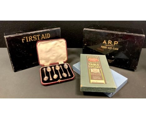 A cased set of six silver Dubarry pattern teaspoons, 40g, London, 1926; a WWII Boots Pure Drug Co. Ltd. enamel First Aid Case