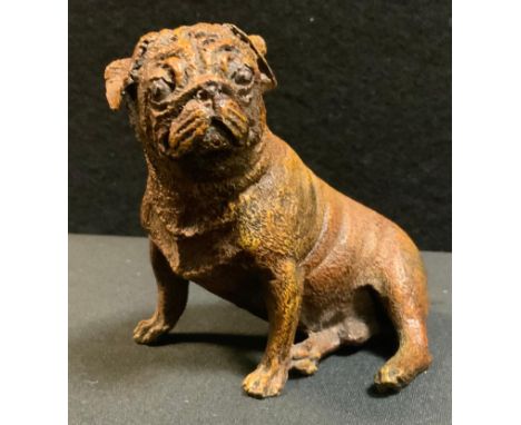 A Reproduction Bergman cast patinated metal model as a seated Pug Dog, cast marks, 8.5cm high 