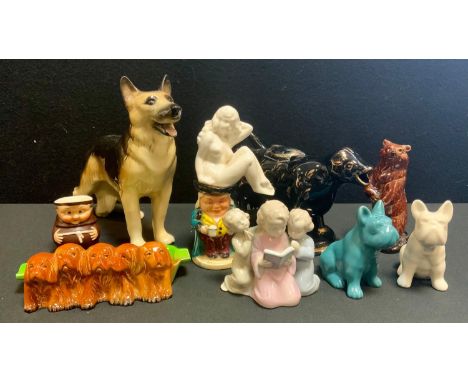 A Metzler and Ortloff model of three children kneeling at prayer, a pair of novelty Pug dog salt and pepper pots;  Cow Creame