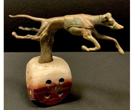 An unusual cast metal model of a racing greyhound at speed wearing No.1, mounted on a alabaster base in the form of die 