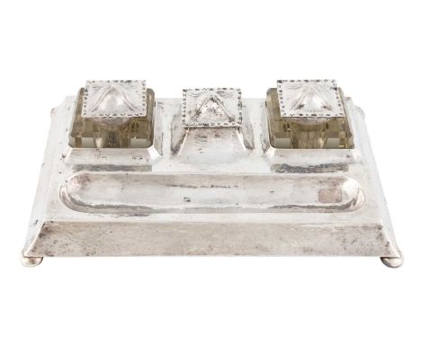 By Herbert Maryon, an Arts &amp; Crafts silver inkstand,Chester 1910,rectangular form with spot-hammered decoration, two silv