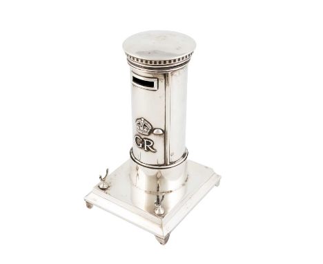 A silver novelty inkstand, by Goldsmiths &amp; Silversmiths Co., London 1923,in the form of a pillar box with an applied crow