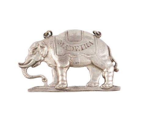 A rare George III silver armorial wine label, by Edward Farrell, London 1815, modelled as an elephant in a standing position,