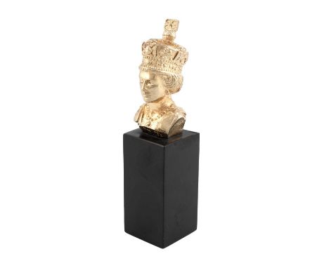 By Stuart Devlin, a commemorative silver-gilt paperweight, London 1977, also with the Jubilee mark, modelled as the bust of Q