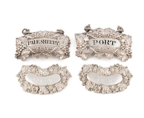 A matched pair of Victorian silver wine labels, by Taylor & Perry, Birmingham 1843 and 1846, shaped oval form with vine and g