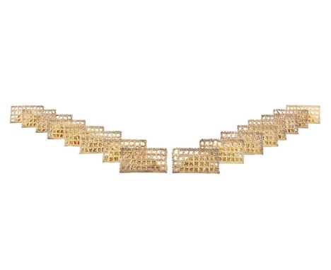 By Stuart Devlin, a set of sixteen modern silver-gilt place holders, London 1977, rectangular form, pierced and textured fili