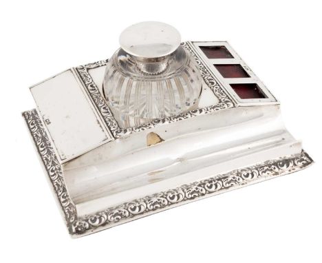 A late-Victorian silver inkstand,by Gibson &amp; Langman, London 1898,rectangular form with scroll foliate borders, with a fr