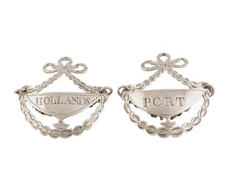 Two George III silver wine labels, by Hester Bateman, London circa 1785, pierced urn form, bright-cut decoration, with ribbon