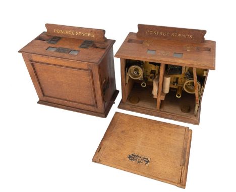 Two early-20th century postage stamp dispensers,by The British Stamp &amp; Ticket Automatic Delivery Company Ltd, Queen Anne'
