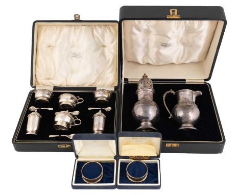A cased six-piece silver condiment set,by Adie Brothers Ltd, Birmingham 1934,faceted circular form with a Celtic border, comp