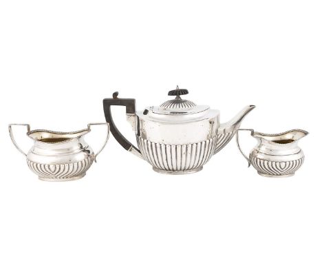 A matched three-piece silver tea set,by William Hutton and Sons, London 1908 and Henry Wilkinson, Birmingham 1913,oval and ob