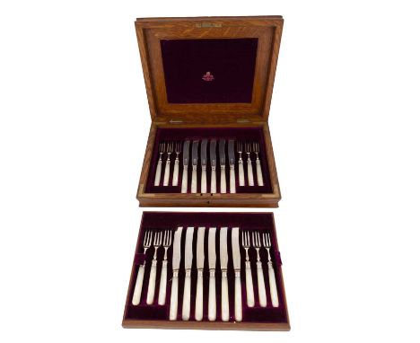A matched set of twelve Edwardian silver and mother-of-pearl fruit knives and forks,by William Hutton &amp; Sons Ltd, London 