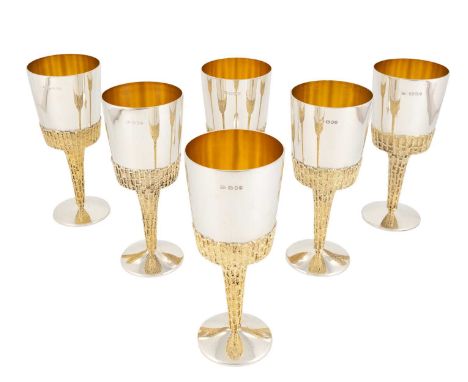 By Stuart Devlin, a matched set of six modern large parcel-gilt silver water goblets, London, two 1976, and four 1979, taperi