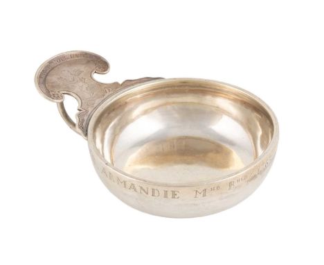 A Louis XV French silver wine taster, by Claude-Alexis Molineau, Paris 1742, circular form, the shaped scroll thumb-piece eng