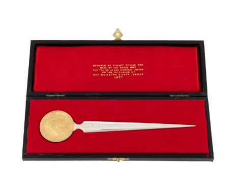 By Stuart Devlin for The Royal Mint, a modern commemorative parcel-gilt silver paperknife for the De La Rue Company Limited, 