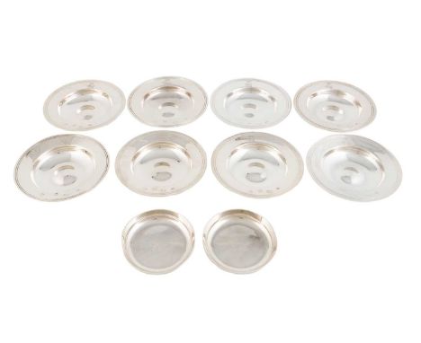 A matched set of eight modern silver nut dishes, by Richard Comyns, London 1961, 1973 and 1974, plain circular form engraved 