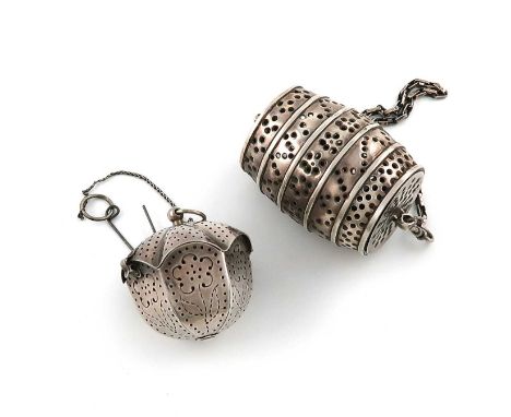 A metalware tea infuser,unmarked,panelled circular form, the hinged cover with a ring a chain and a clip, plus an electroplat