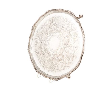 A George III silver salver, by Robert Jones & John Scofield, London 1776, circular form, beaded border, the centre with later