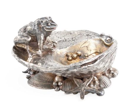 By Michael Allen Bolton, a modern silver salt cellar,London 1994,modelled as an oyster shell with a frog sitting to the edge,